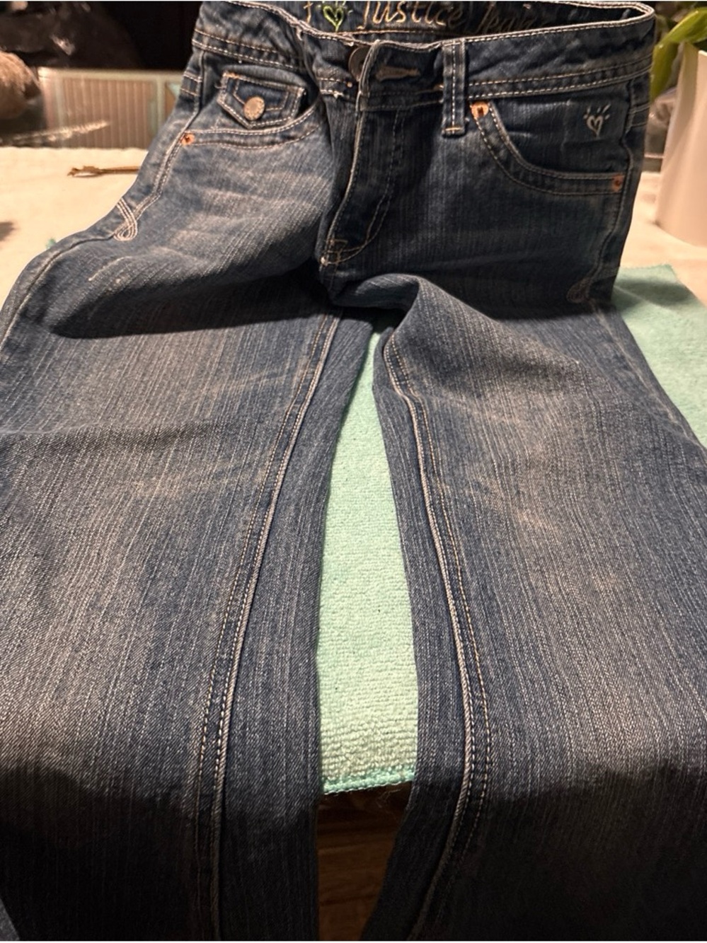 vintage mid-to-light wash Justice girls' bootcut jeans,